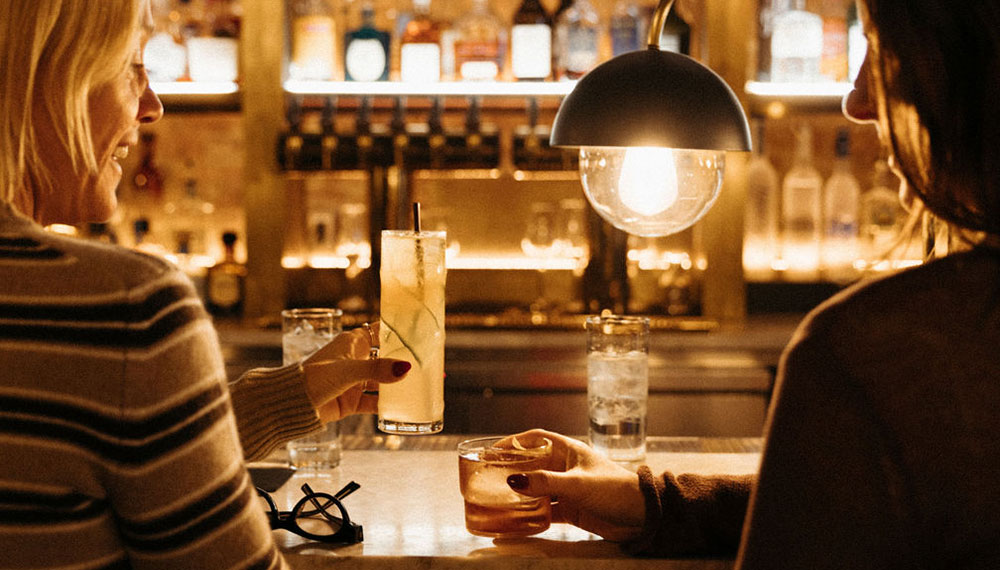 Guests sitting at the bar at Pennyroyal
